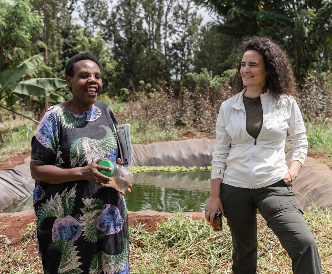 GCF Executive Director Mafalda Duarte (right) with Josephine Wangui Waweru (left), a coffee farmer and entrepreneur in Kenya.  Thanks to support from the GCF-funded Acumen Resilient Agriculture Fund (ARAF), Josephine has been able to sustainably grow her coffee farm into a thriving business through low-cost, pay-as-you-go solar irrigation.   Photo: © GCF / Andy Ball